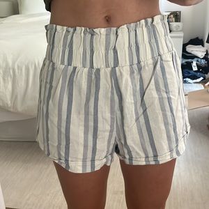 White‎ shorts with blue stripes.  Elastic waist band. High rise. Flowy shorts
